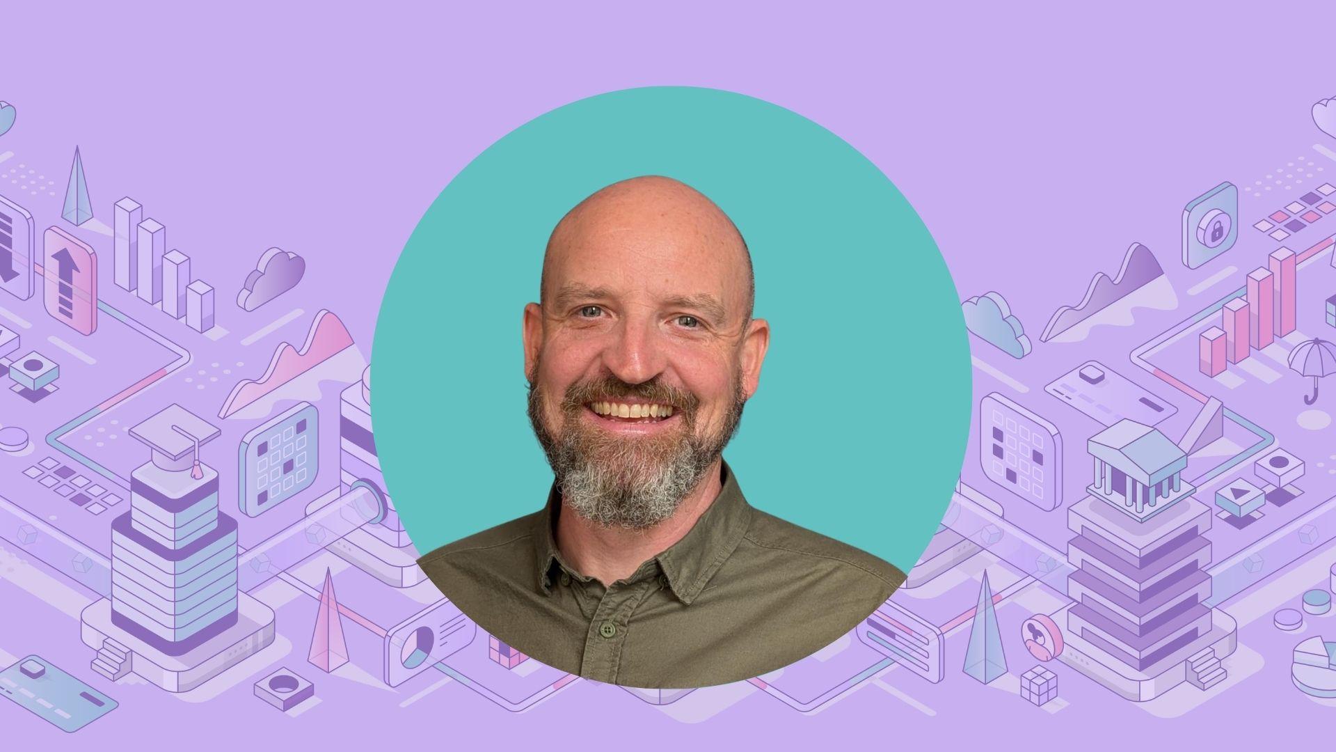 A man with a beard smiling