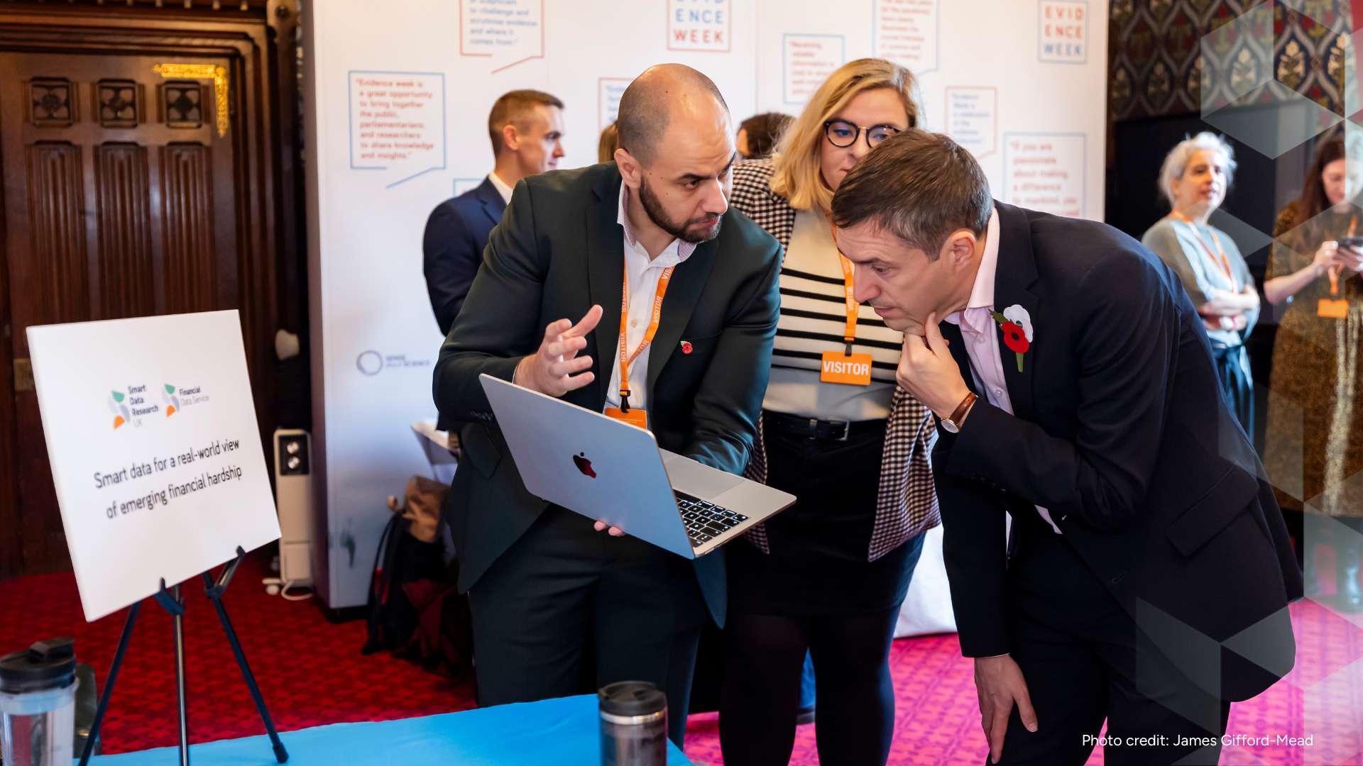Rui Cardoso shows his laptop to Adrian Ramsay MP